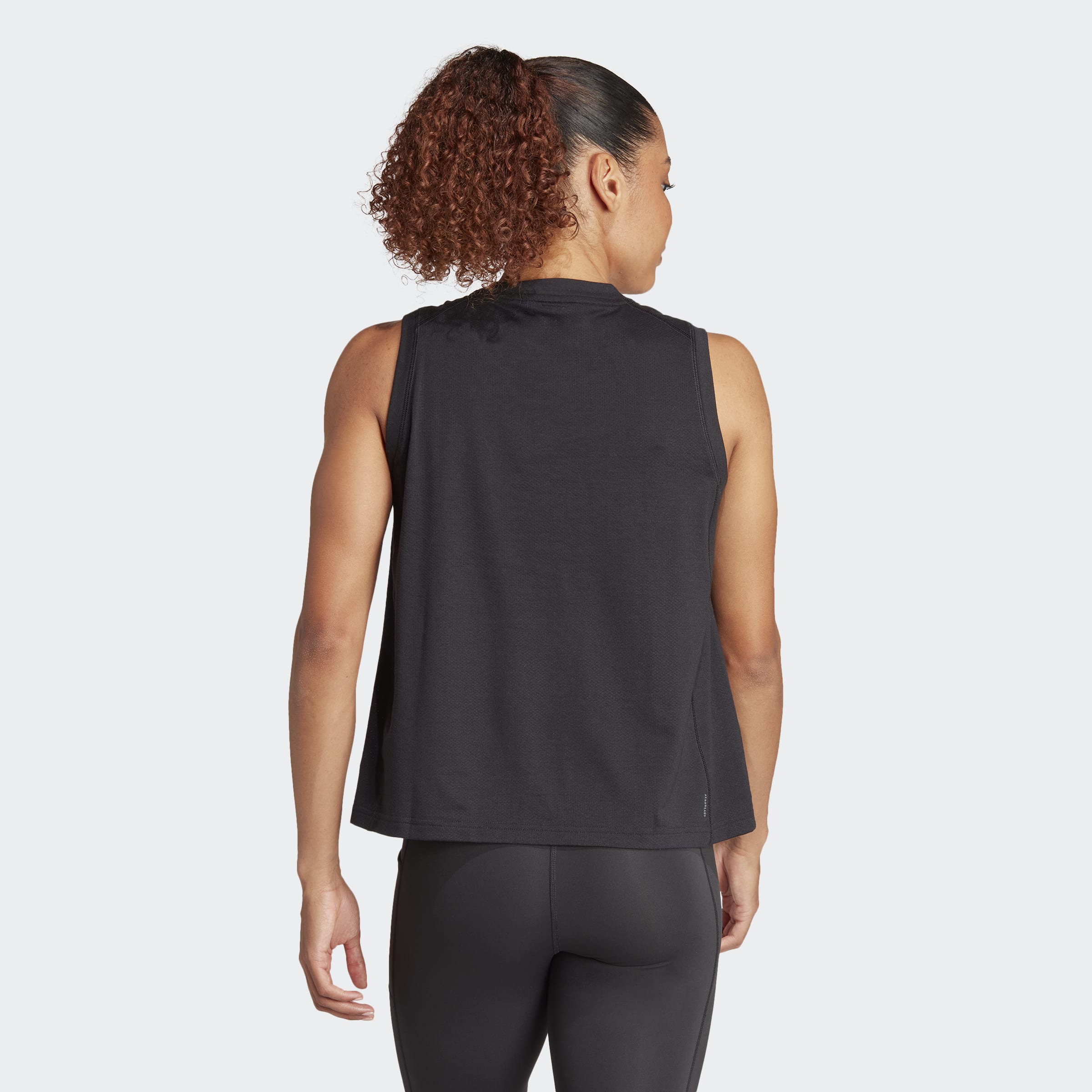 Womens Train Essentials Logo Tanks