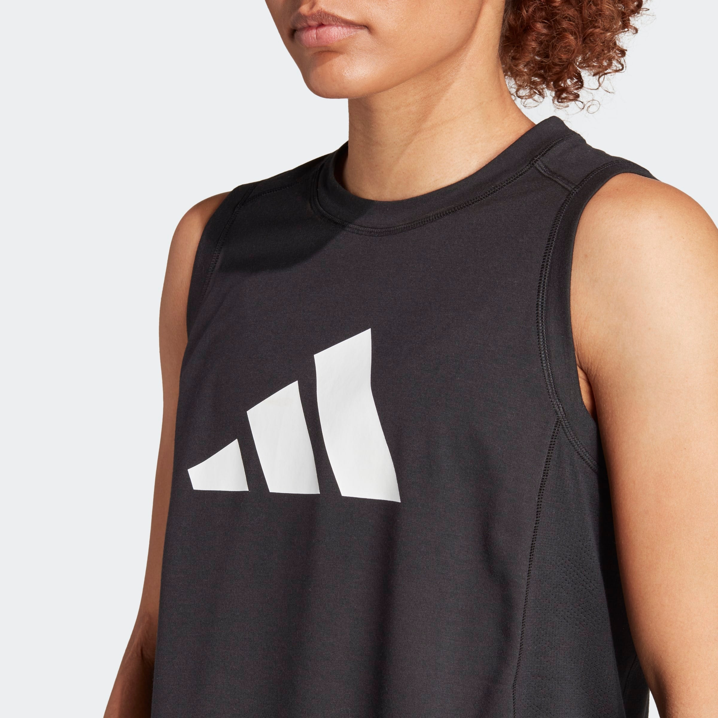 Womens Train Essentials Logo Tanks